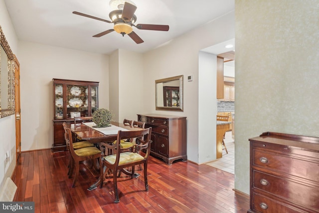 dining room featuring wood-type flooring and ceiling fan