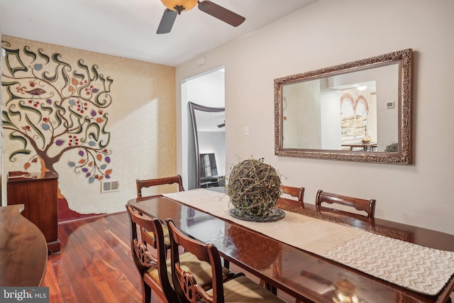 dining area featuring dark hardwood / wood-style floors and ceiling fan