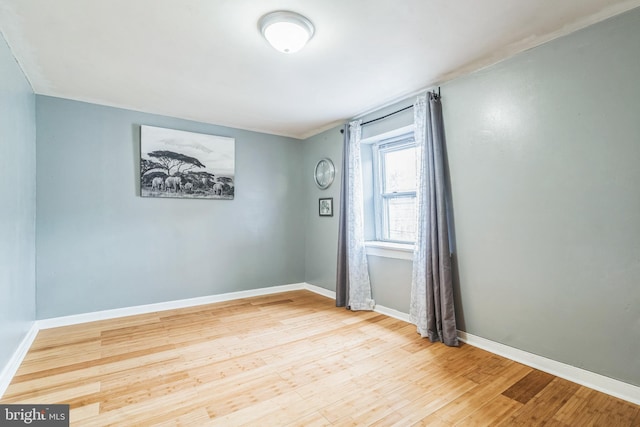 spare room featuring hardwood / wood-style floors