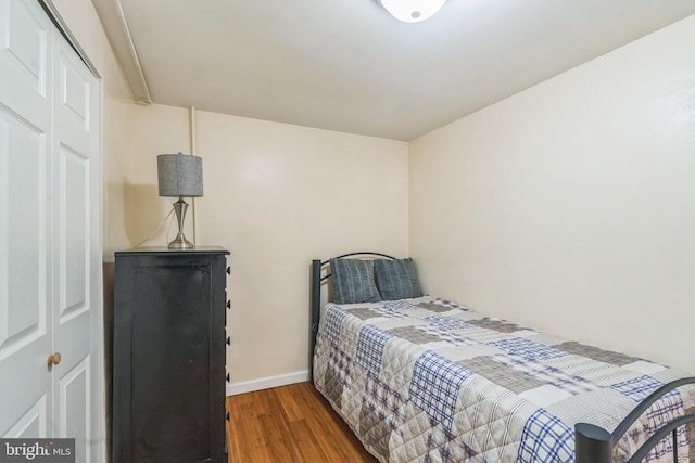 bedroom featuring a closet and hardwood / wood-style floors