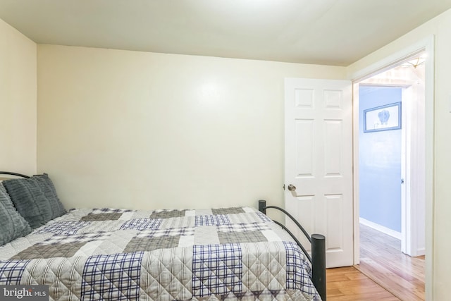 bedroom featuring wood-type flooring