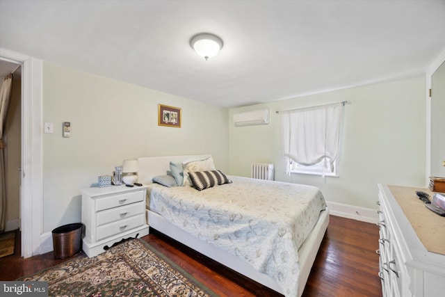 bedroom featuring dark wood-type flooring, a wall mounted air conditioner, and radiator