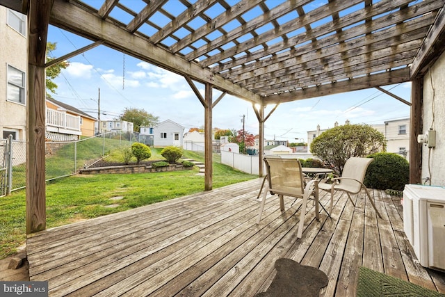 wooden deck with ac unit, a lawn, and a pergola