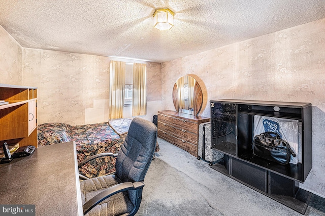 carpeted bedroom featuring a textured ceiling