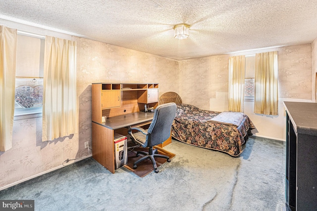 carpeted bedroom featuring a textured ceiling