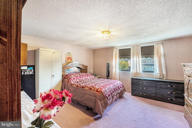 carpeted bedroom with a textured ceiling