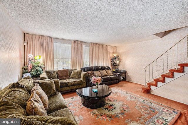 living room with hardwood / wood-style floors and a textured ceiling