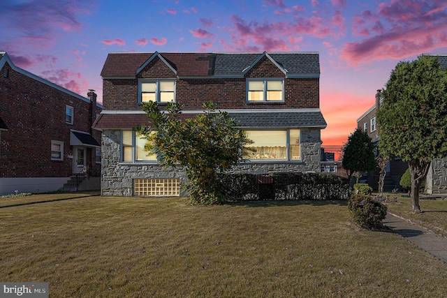 view of front of house with a yard