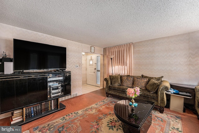 living room with a textured ceiling