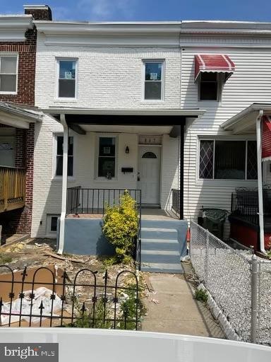 view of property featuring a porch