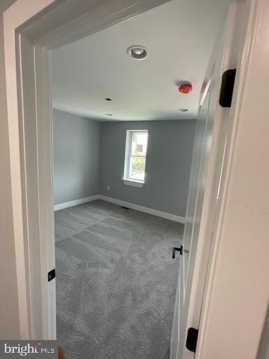 empty room featuring carpet floors