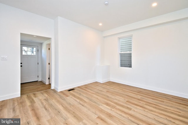 spare room with light hardwood / wood-style flooring