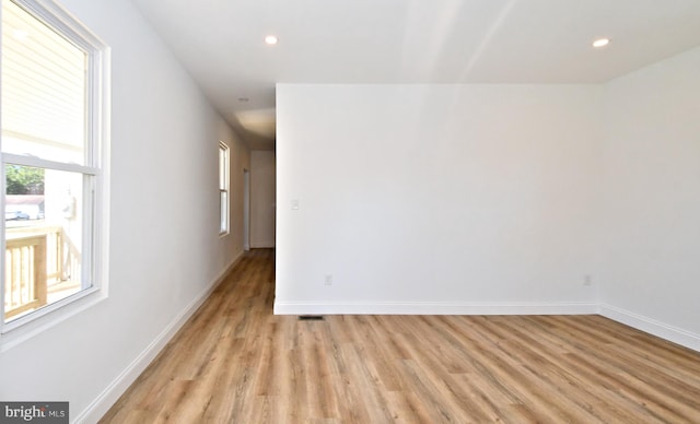 unfurnished room featuring light hardwood / wood-style flooring