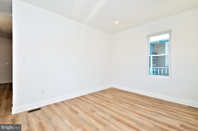 spare room featuring light hardwood / wood-style flooring