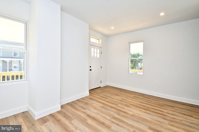 foyer entrance with light wood-type flooring