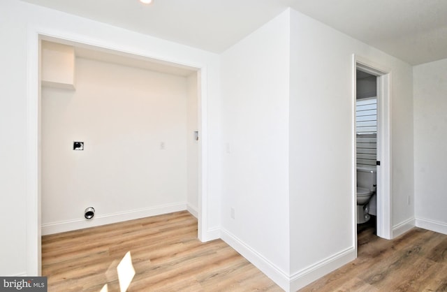 clothes washing area with hookup for an electric dryer and hardwood / wood-style floors