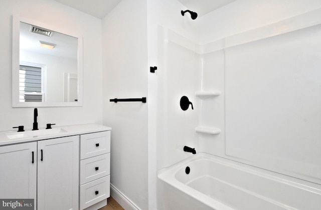 bathroom featuring vanity and tub / shower combination