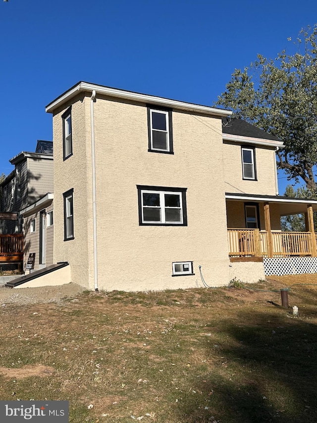 exterior space with a deck and a yard