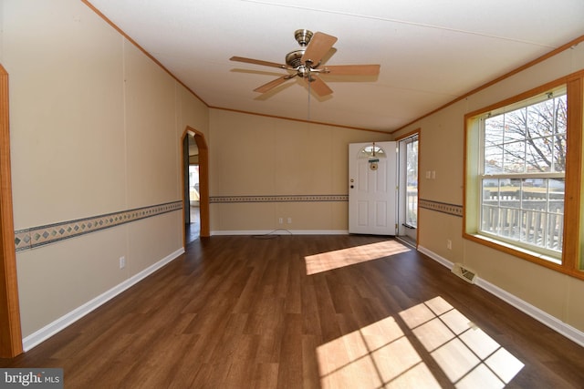 interior space with crown molding, dark wood-type flooring, and ceiling fan