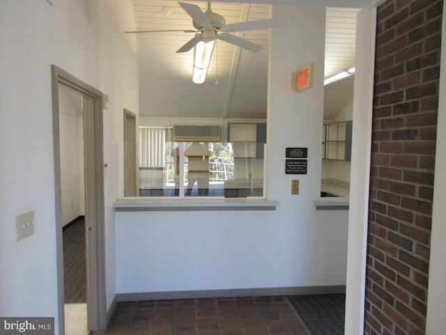 kitchen with ceiling fan and vaulted ceiling