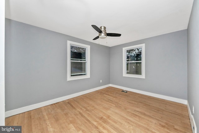 spare room featuring ceiling fan and light hardwood / wood-style flooring