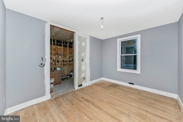 empty room featuring hardwood / wood-style flooring