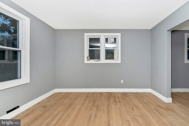 unfurnished room with light hardwood / wood-style flooring