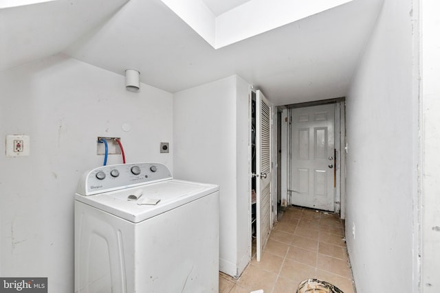 washroom featuring washer / clothes dryer and light tile patterned floors