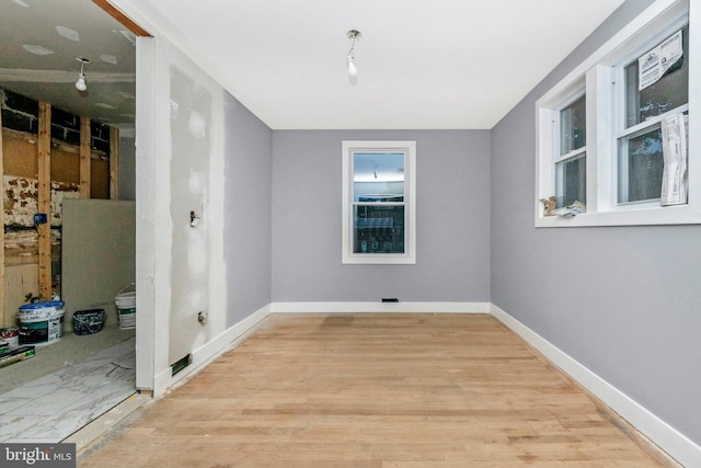 laundry room with light wood-type flooring