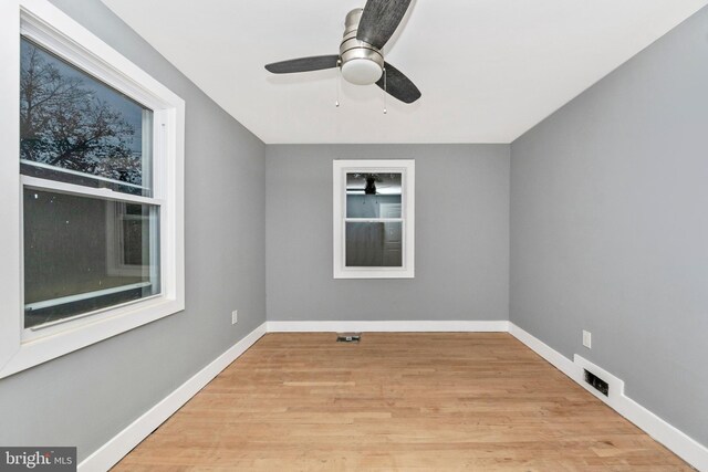 spare room featuring ceiling fan and light wood-type flooring