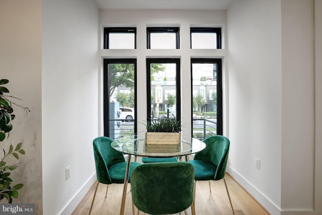 dining space featuring hardwood / wood-style flooring