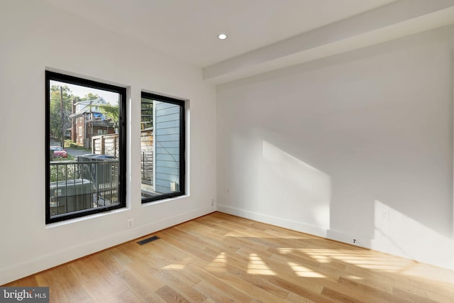 unfurnished room featuring light wood-type flooring