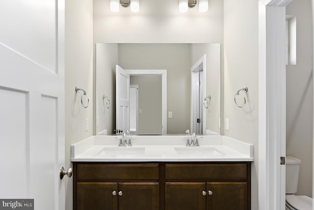 bathroom with vanity and toilet