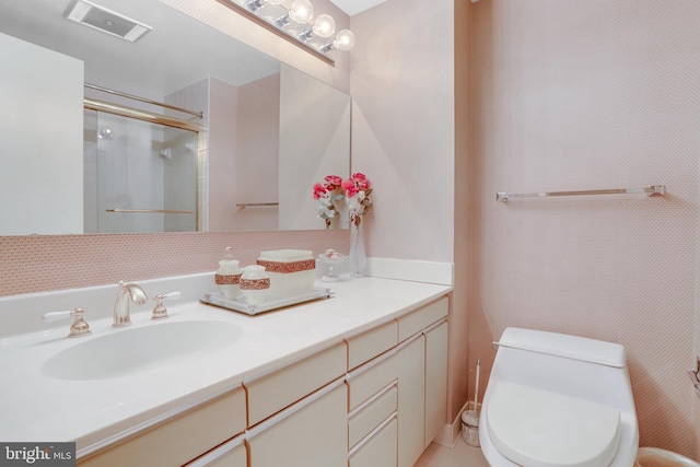 full bathroom featuring an enclosed shower, toilet, visible vents, and vanity
