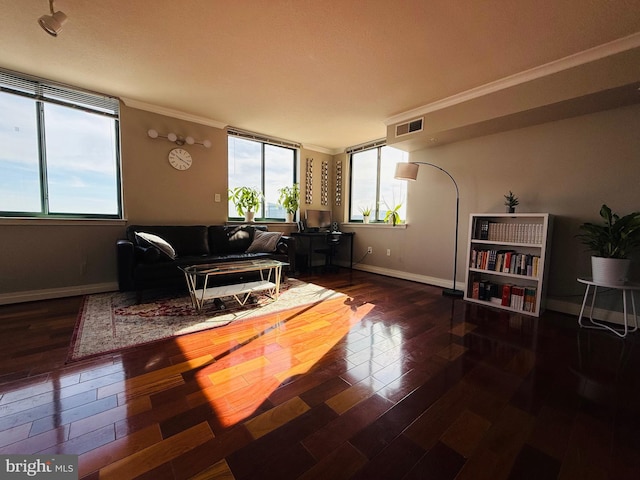 living room with crown molding and dark hardwood / wood-style floors