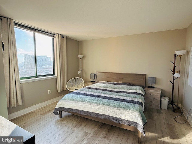 bedroom with light hardwood / wood-style flooring