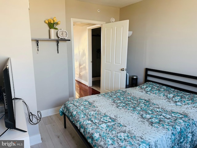 bedroom featuring hardwood / wood-style floors