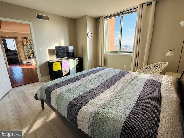 bedroom featuring light wood-type flooring