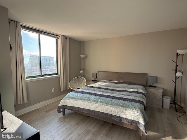 bedroom with light wood-type flooring