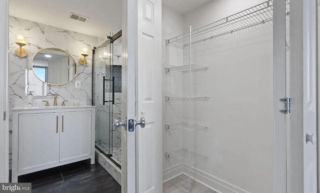 bathroom with vanity and walk in shower