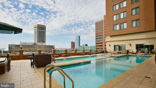 view of swimming pool featuring a patio