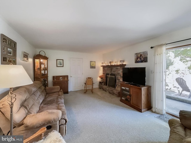 carpeted living room with a fireplace