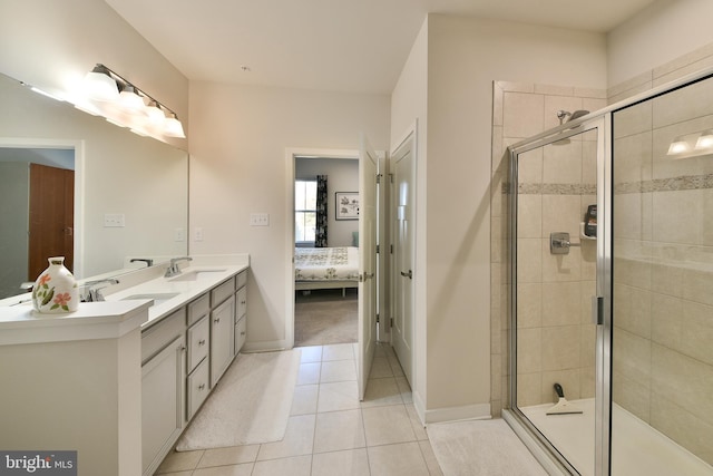 bathroom with vanity, walk in shower, and tile patterned flooring