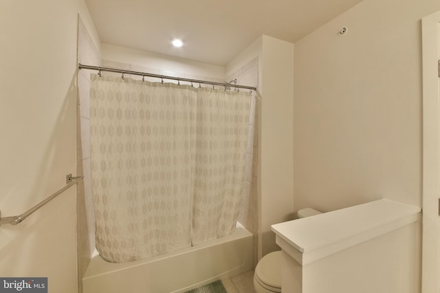 bathroom with toilet, tile patterned floors, and shower / bathtub combination with curtain