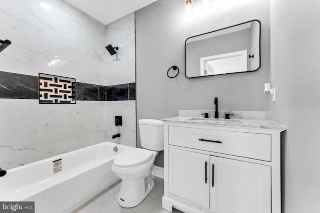 full bathroom featuring vanity, toilet, and tiled shower / bath combo