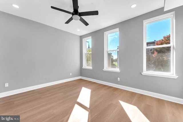 spare room featuring ceiling fan and light hardwood / wood-style floors