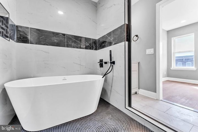 bathroom featuring a washtub