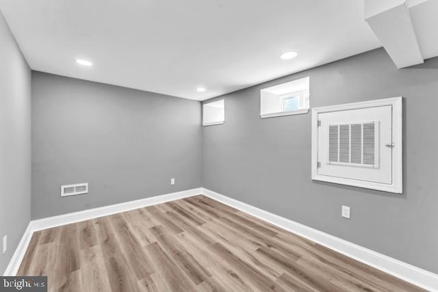 basement featuring light wood-type flooring