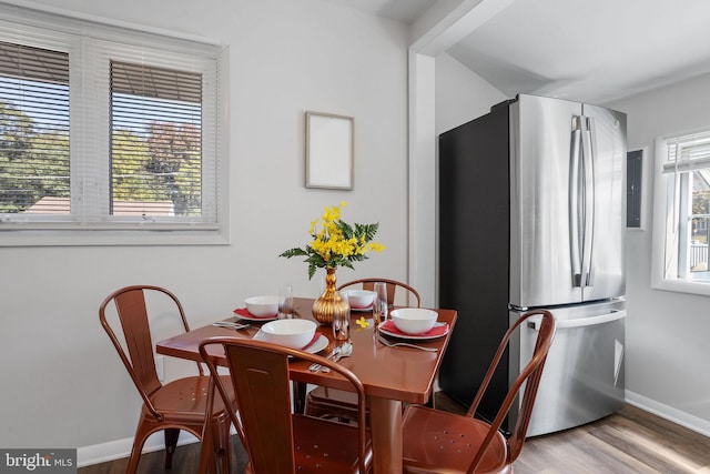 dining space with a healthy amount of sunlight and wood-type flooring