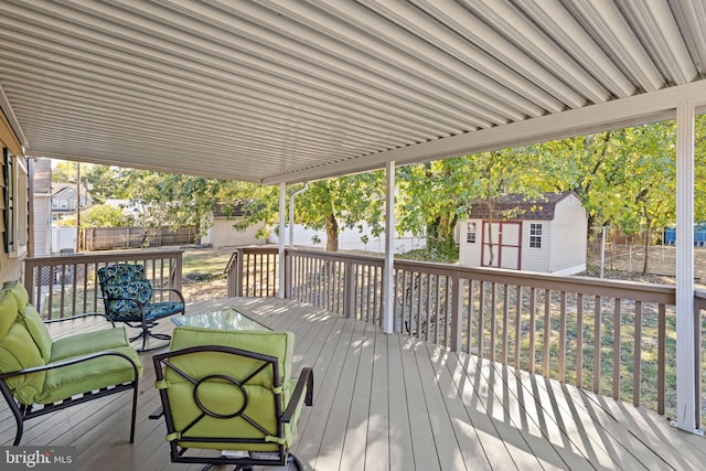 wooden deck featuring a storage unit